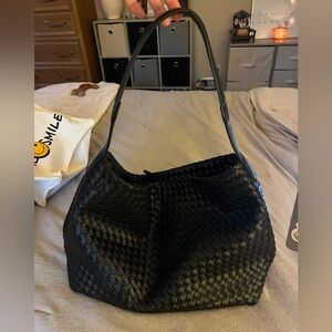 black woven tote bag